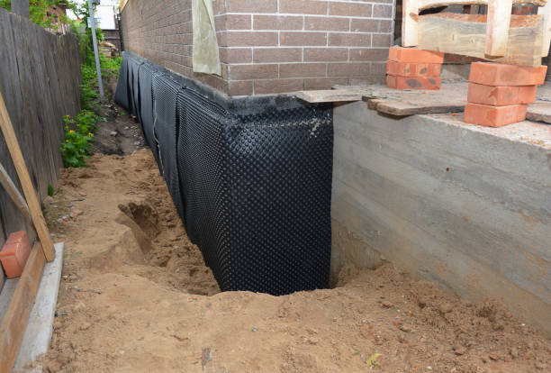 SJ Waterproofing Pros technician performing targeted Exterior Waterproofing assessment in Rossville, KS